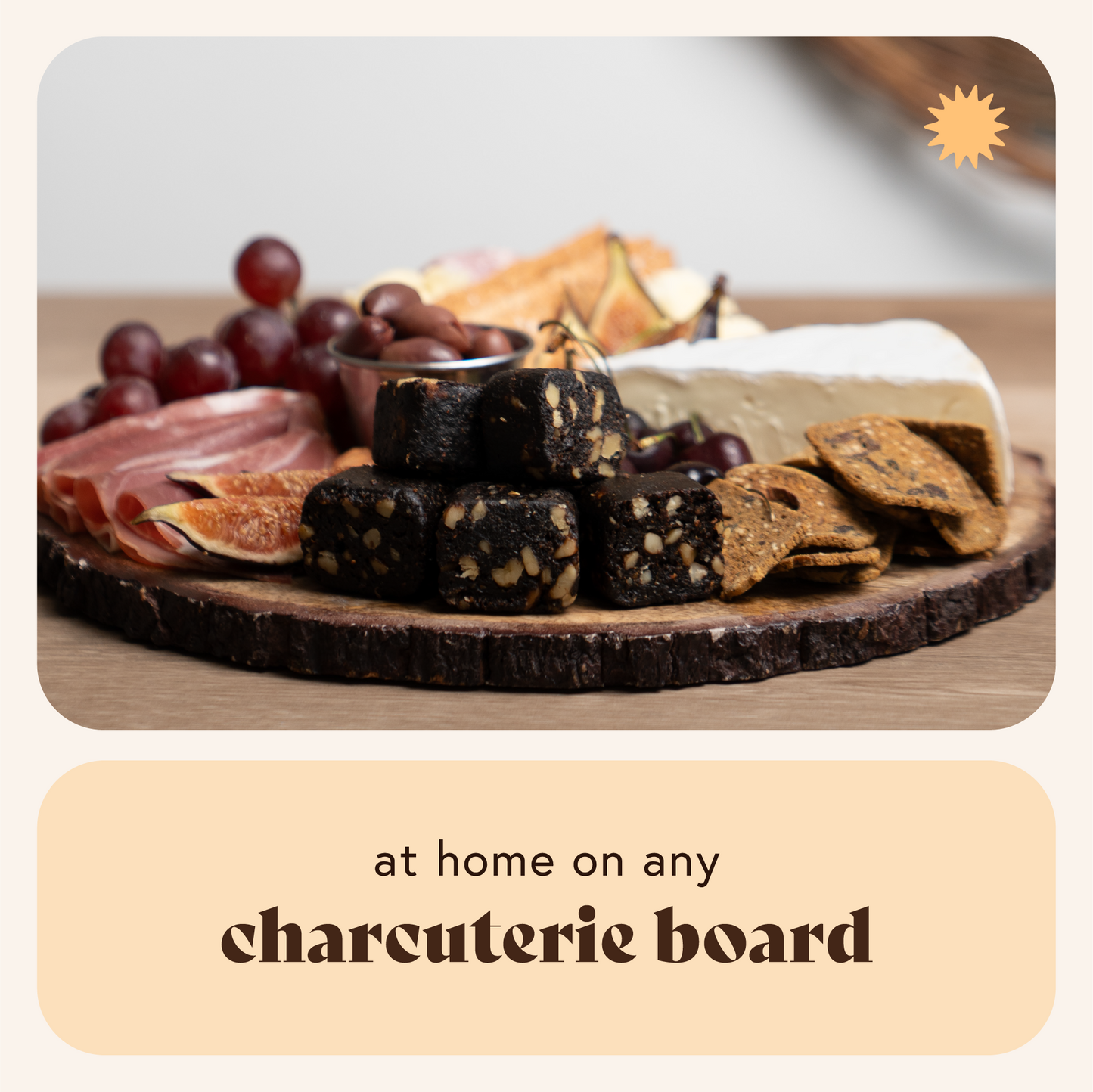 Assorted charcuterie board with meats, cheeses, and crackers on a wooden board.