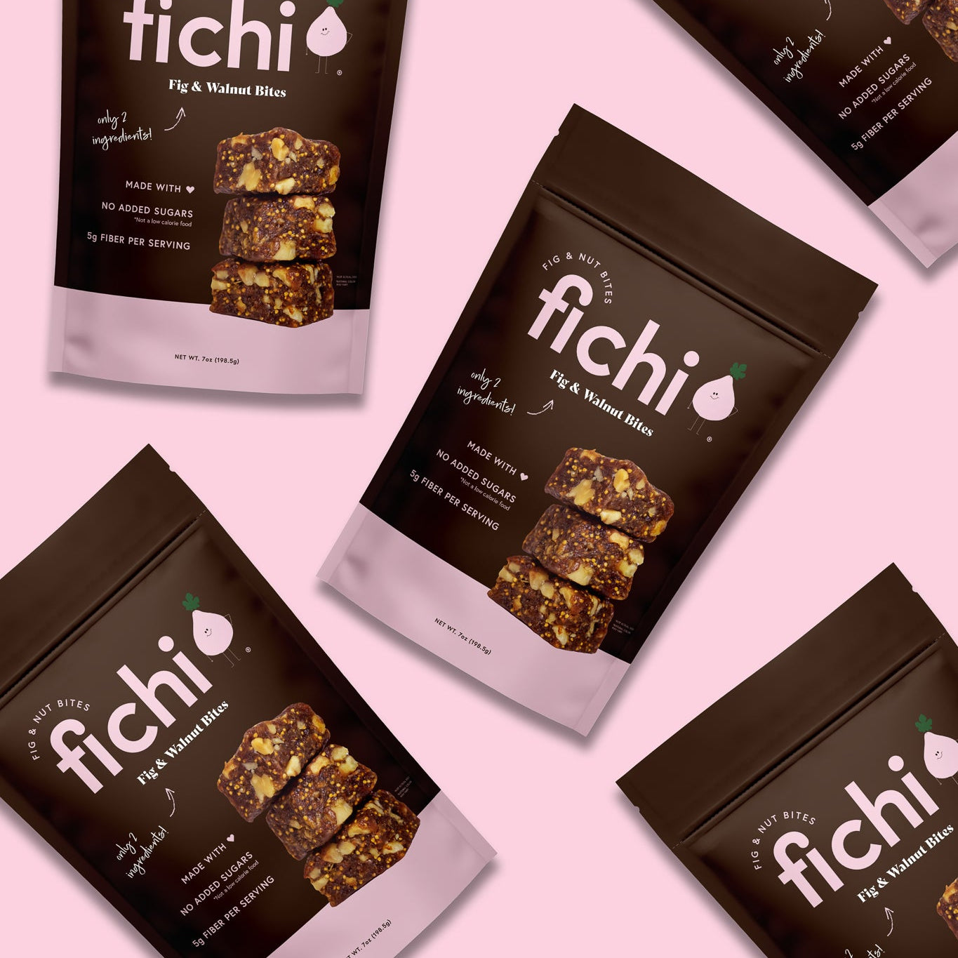 Fichi Fig and Walnut snack packages on a pink background.