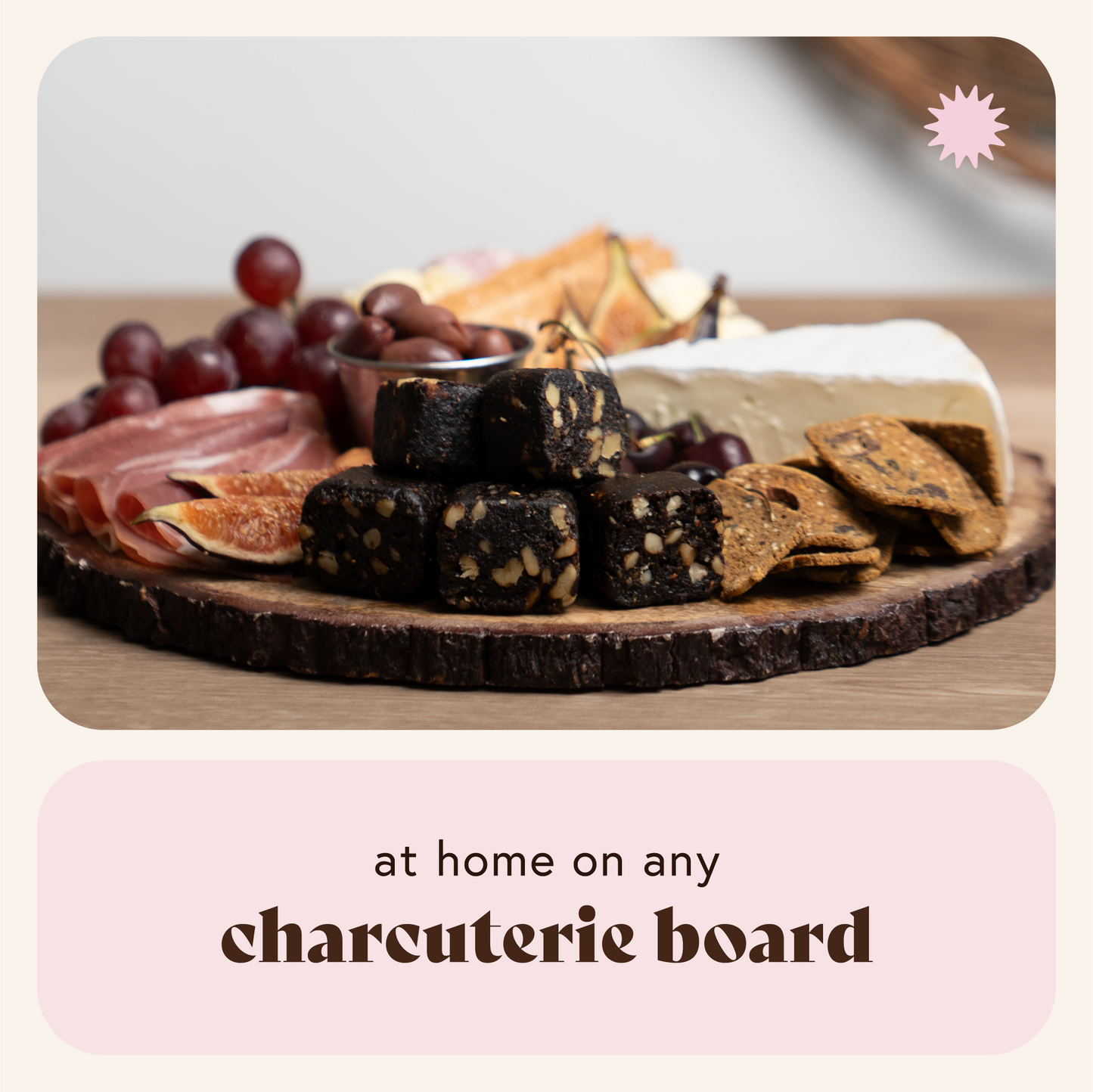 Wooden charcuterie board with assorted meats, cheeses, and crackers on a neutral background.