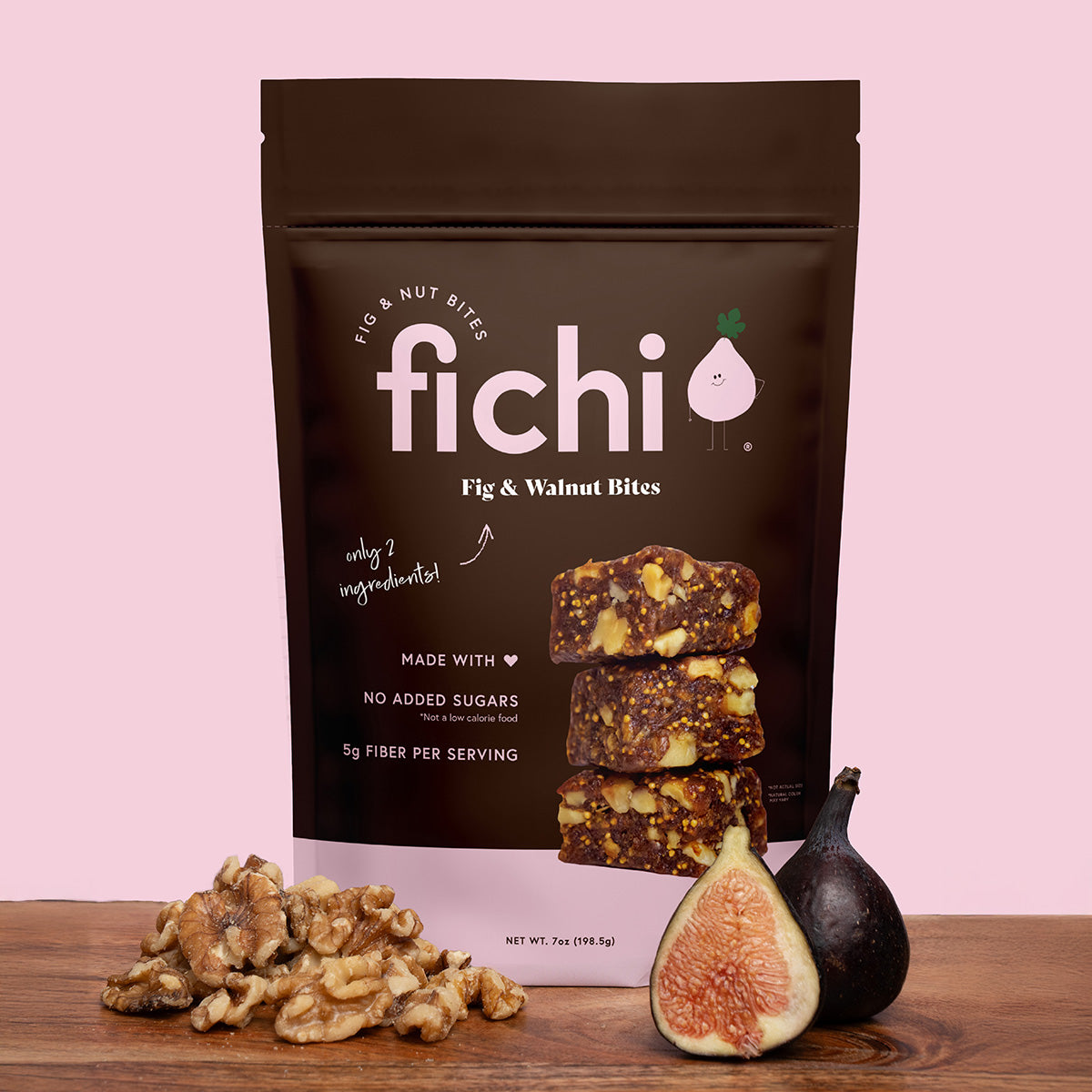 Fichi Fig & Walnut Bites packaging with figs and walnuts on a pink background.